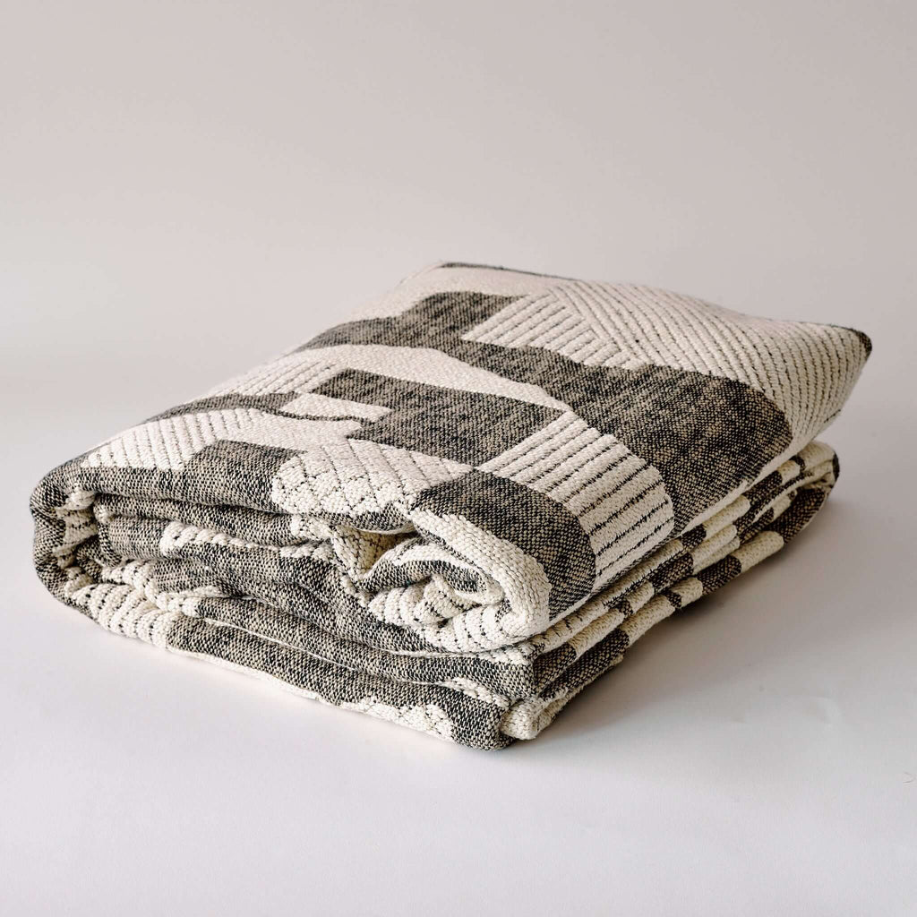 ebley bedspread folded with bespoke print and high quality fabric linen